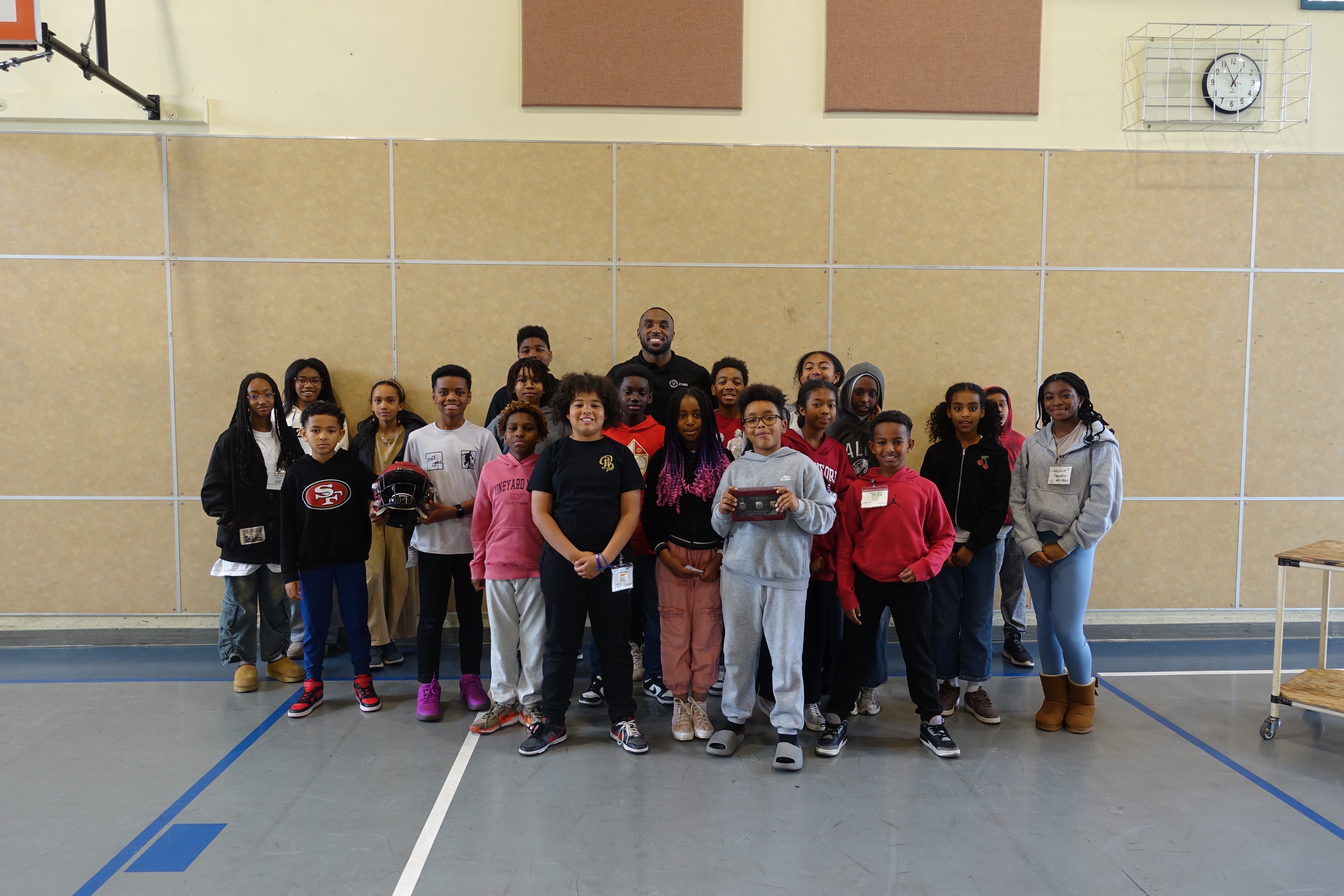 DT Cares mentorship program with students and mentors in school gymnasium